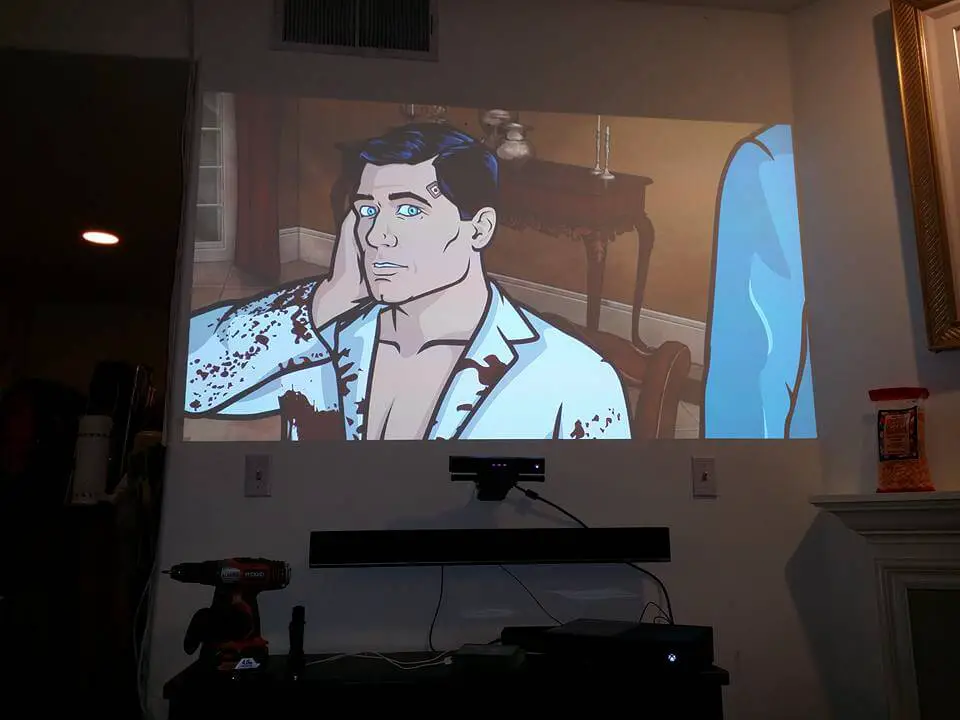 Is it better to mount your soundbar above the projector or Tv than below