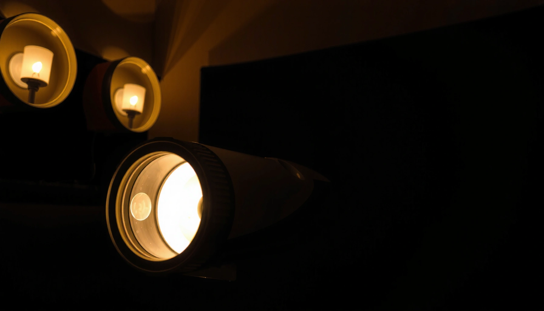 A close-up of a projector lamp, illustrating signs of wear and tear for replacement guidance.